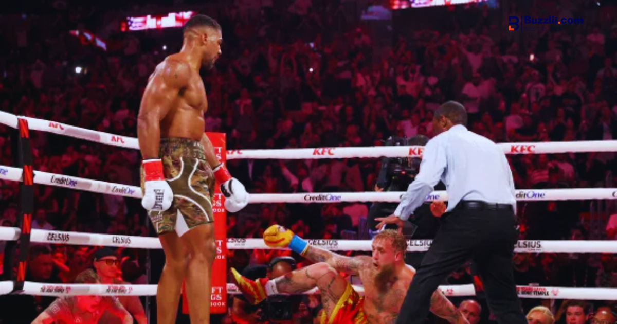 Anthony Joshua delivers a right hand to Jake Paul during their heavyweight boxing match in Miami