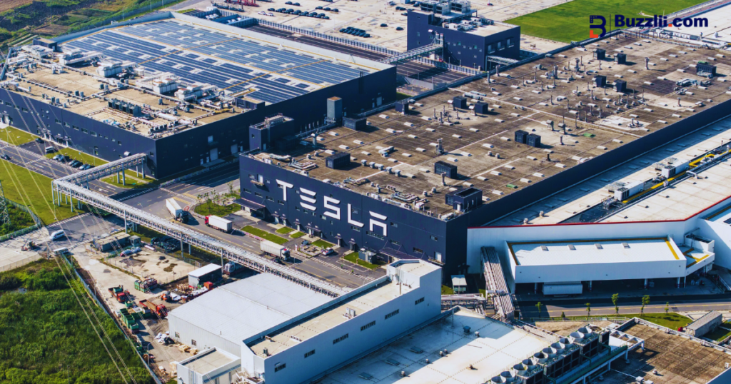 Elon Musk at a Tesla facility highlighting electric vehicle manufacturing